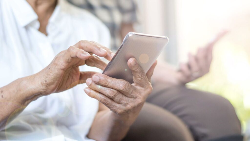 Elderly Person Using Cell phone Mobile